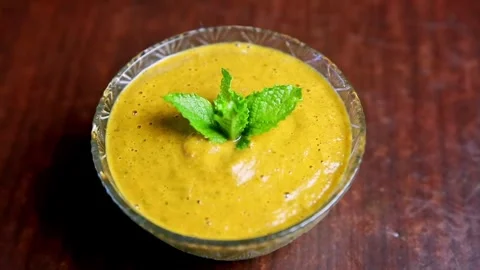 Momo Pickle or chutney served in a glass bowl with mint leaves Stock Footage 243574434