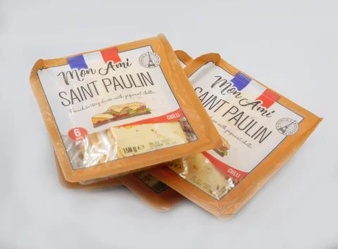 Mon Ami Saint Paulin Chilli cheese slices packages on white. Stock Photos