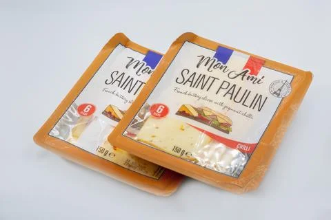 Mon Ami Saint Paulin Chilli cheese slices packages on white. Stock Photos