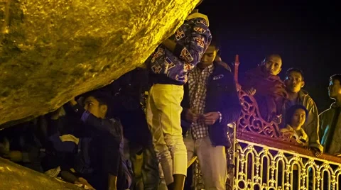 Mon state, myanmar - 04 jan 2014: only male people glued small pieces of gold Stock Footage 40666904
