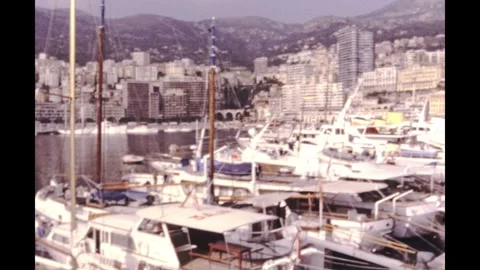 Monaco 1970s, River with ships and speedboats close to town Stock Footage 241285906