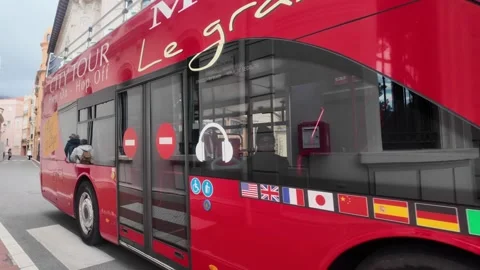 Monaco Courthouse - Red Tour Bus Passing Building Stock Footage 329552271