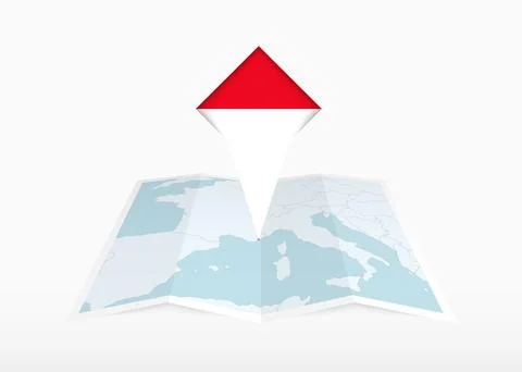 Monaco is depicted on a folded paper map and pinned location marker with fl.. Stock Illustration