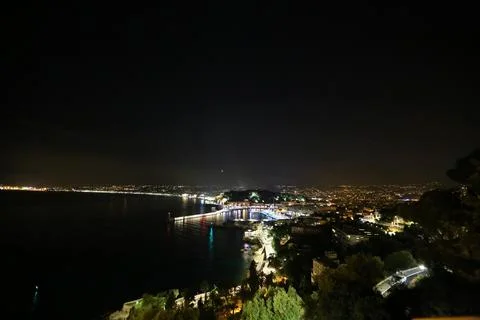Monaco elevated night view, illuminated harbor and coast, evening panorama .. Stock-Fotos
