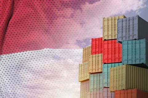 Monaco flag and big stack of shipping cargo containers in docks with sky Foto stock