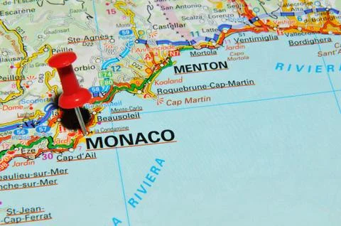 Monaco marked with red pushpin on map Stock Photos