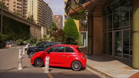 Monaco Red Compact Car Parked Near Luxury Residential Building 4K Stock Footage 334426559