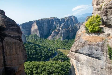 Monasteries built on cliffs, Meteora on a hot summer day, Greece Stock Photos