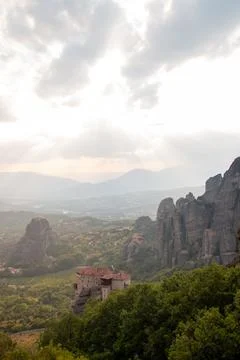 Monasteries built on cliffs, Meteora at sunset, Greece Stock Photos