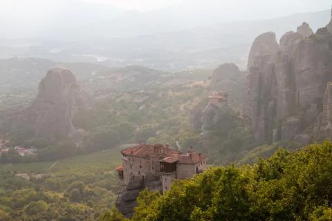 Monasteries built on cliffs, Meteora at sunset, Greece Stock Photos