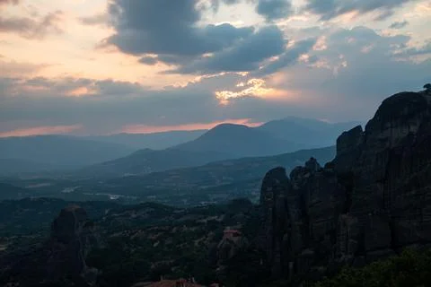 Monasteries built on cliffs, Meteora at sunset, Greece Stock Photos