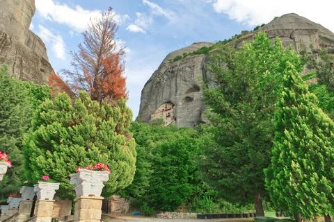 Monastery built into a cave on a cliffside in Meteora Kastraki village, Greece Stock Photos