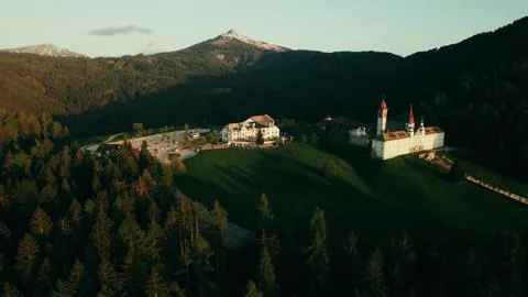 Monastery with a chapel among the spruce forest on the mountain Stock Photos