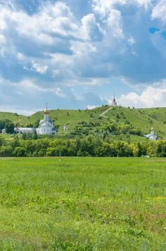 Monastery complex with white churches with golden cupola Stock Photos