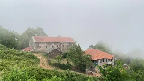 Monastery at mount Olympus: Trees and Clouds in a Tarkovsky-Inspired Style Stock Footage 284821196