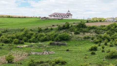 A monastery nestled in the hills Видео 341275683