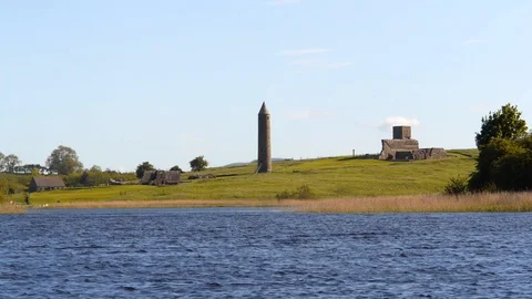Monastery Round Tower by Lakeside Devenish Island Northern Ireland Stock Footage 98429490