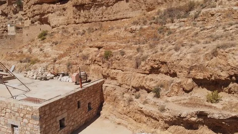 Monastery of Saints George and John Jacob of Choziba. Hermit caves in the rocks. Stock Footage 113244625