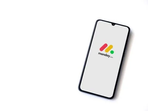 Monday app launch screen with logo on the display of a black mobile smartphon Stock Photos