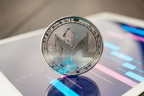 Monero cryptocurrency on the tablet Stock Photos