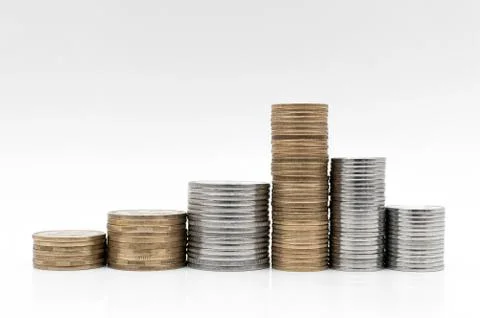 Money and coins on a white surface Stock Photos