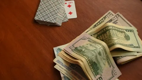 Money and a deck of cards on the table. Stock Footage 301180404