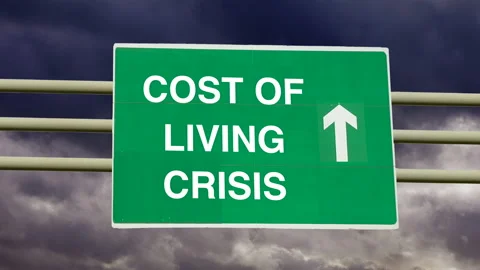 Money and finance problems. Cost of Living Crisis sign with time lapse clouds. Stock Footage