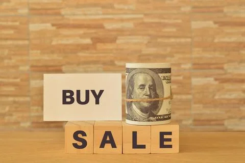 Money banknote note and phrase BUY and SALE. Business concept. Stock Photos