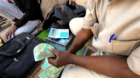 Money changer in Somaliland  Stock Footage 90667846