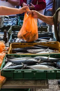 Money changes hands at Split's fish market Stock Photos