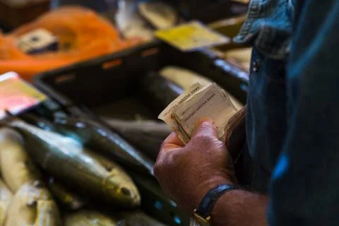 Money changes hands at Split's fish market Stock Photos