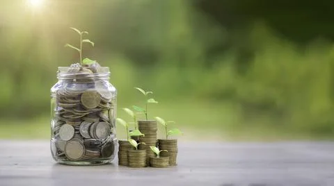 Money coin stack growing graph with glass jar saving concept. business financ Stock Photos