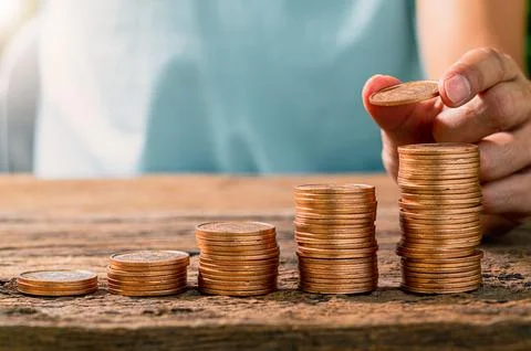 Money coin stack growing graph with sun light bokeh background,investment c.. 스톡 사진