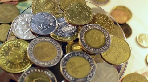Money Coins And Bills Are Rotated on a Wooden stand Stock Footage 59666880