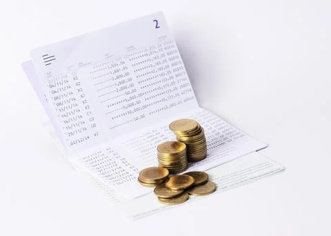 Money Coins stack and book bank saving plan for loan concept Stock Photos