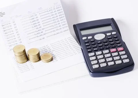 Money coins stack and calculator and book baank loan money concept Stock Photos