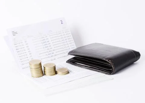Money coins stack and pocket on book bank saving loan concept Stock Photos