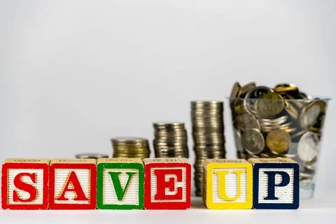 Money coins stack stair as step growing growth and wooden cube block with wor Stock Photos