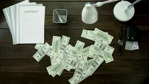 Money is collected in a heap on the office table. Stock Footage 82175967