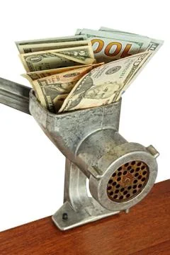 Money concept with dollar banknotes in meat grinder taken closeup. Stock Photos