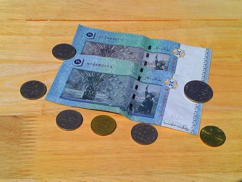 Money concept with malaysian ringgit and malaysian coins 스톡 사진