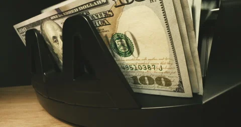 Money counter checking amount of 100 dollar bills. USD Notes. Cinematic look. 스톡 동영상 150953763