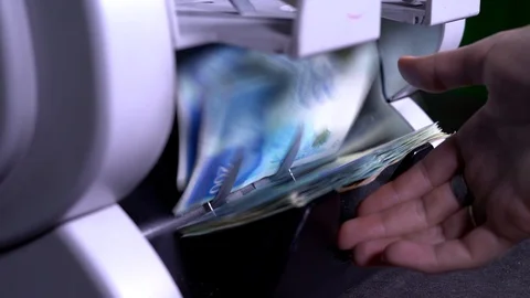 Money counter machine. Female pulls out money . Currency, detector counting Stock Footage 115403121