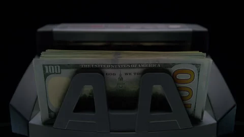 Money counter machine with stack of dollars Stock Footage 332720477