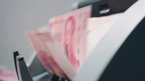 Money Counters And 100-china Banknotes Stockbeeldmateriaal 130842500