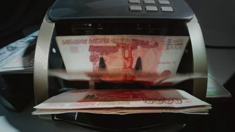 Money counting machine. 5000 Russian Ruble banknotes. Bank automatic equipment Stock Footage 319758022