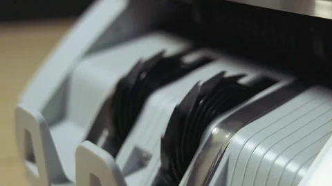 Money counting machine counts 100 dollar bills Stock Footage