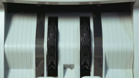 Money counting machine counts 100 dollar bills. Close up shot Stock Footage