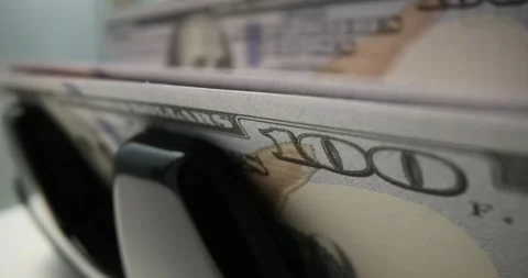 Money counting machine counts large stack of dollar bills Stock Footage 318328268