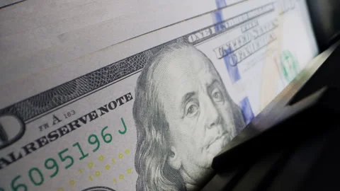 Money counting machine processes cash as part of fraud prevention procedures Stock Footage 340023723